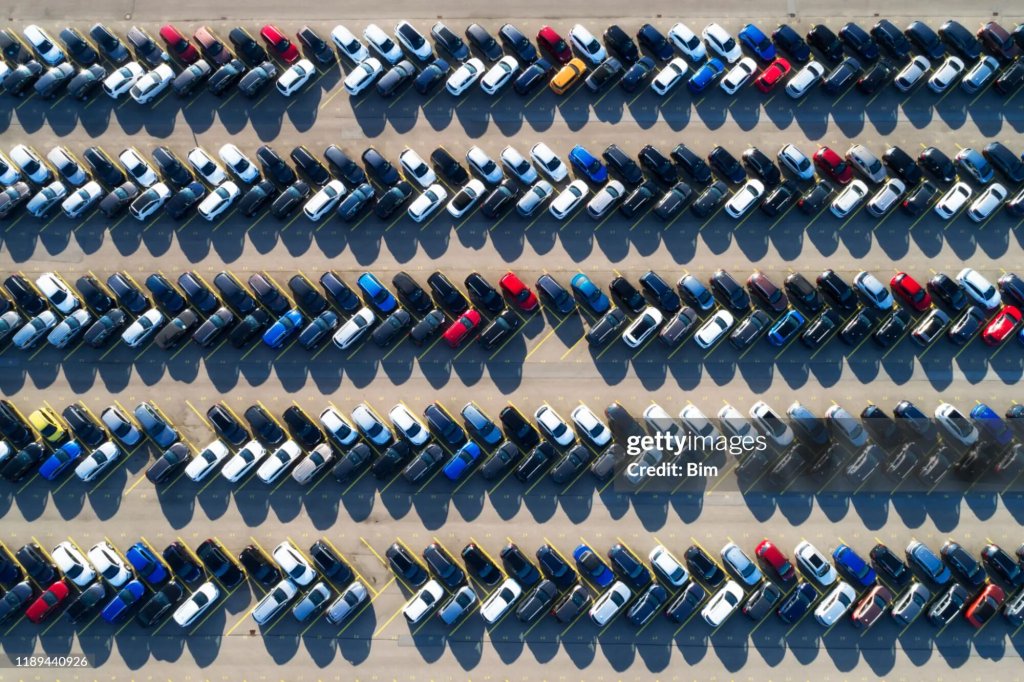 Aerial view of rows of vehicles in secure storage.